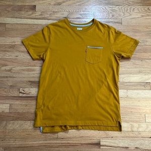 Mustard Levi T-shirt with front Levi Logo pocket. Size~ Lrg
